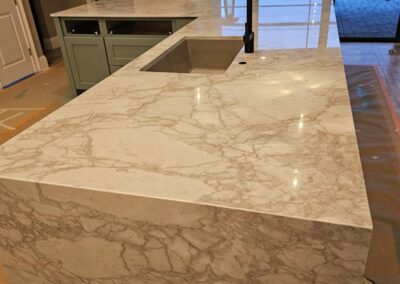 Kitchen island with waterfall leg _Material quartzite_Top Granite and Kitchen 20240322